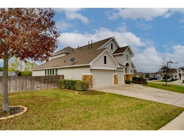 a view of a backyard of the house