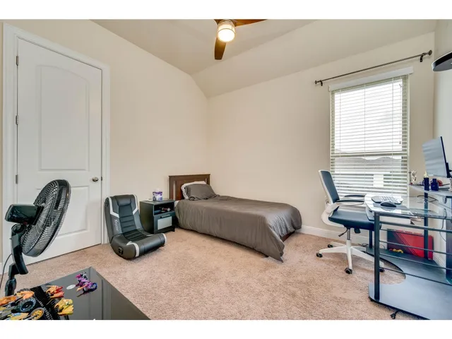 a living room with furniture a rug and a window
