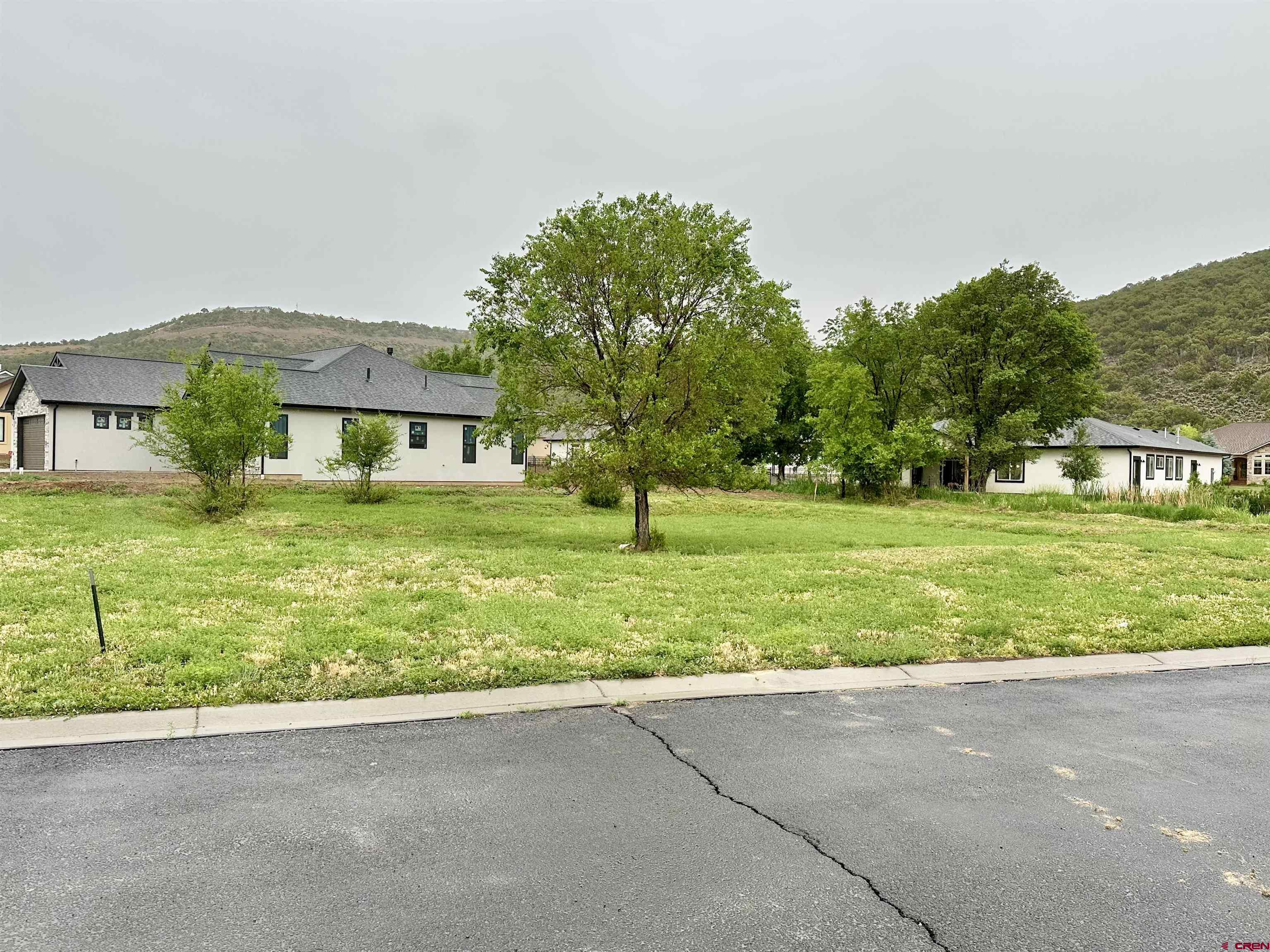855 Southeast Pinyon Street Cedaredge, CO 81413 - Photo 5 of 7 a front view of a house with a yard