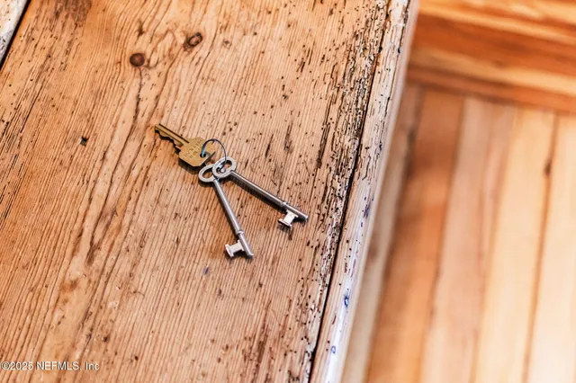 a kitchen with a stove a refrigerator and a stove top oven