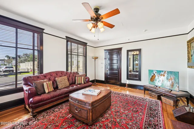 a view of living room with furniture and a window
