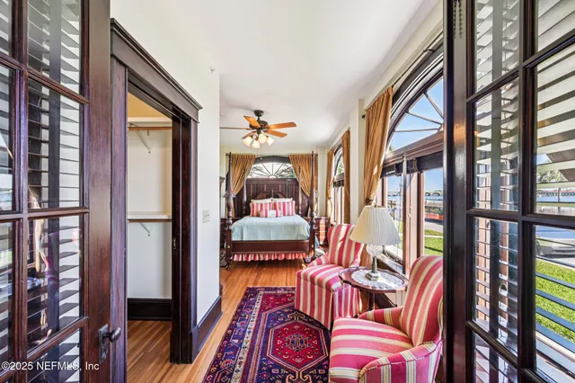 a living room filled with furniture and a potted plant