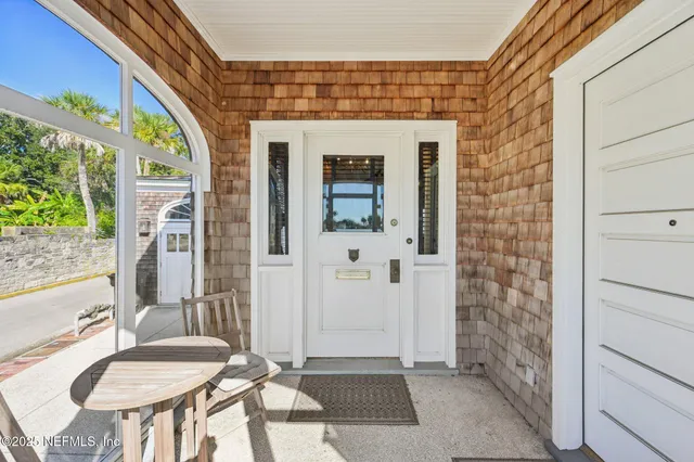 a view of a door and a window in the house