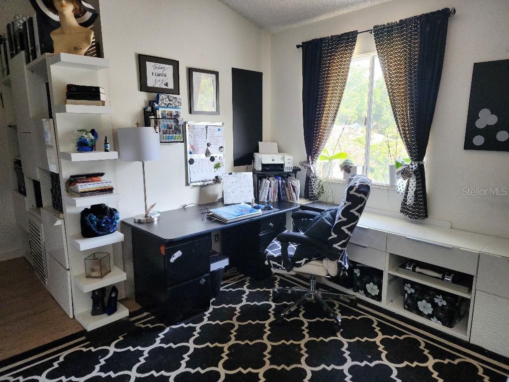 610 Chestnut Oak Circle, Unit 110 Altamonte Springs, FL 32701 - Photo 11 of 15 a room with furniture a window and a flat screen tv