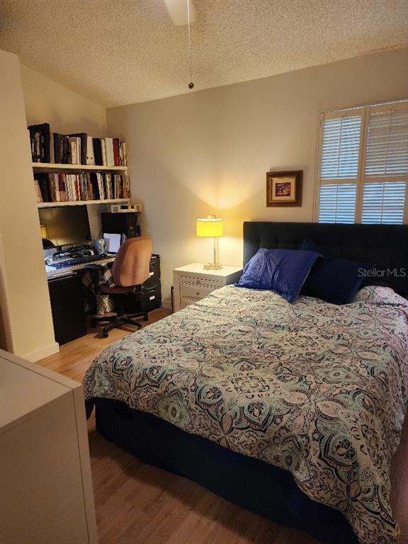 610 Chestnut Oak Circle, Unit 110 Altamonte Springs, FL 32701 - Photo 13 of 15 a bedroom with a bed and dresser