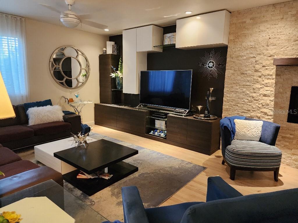 610 Chestnut Oak Circle, Unit 110 Altamonte Springs, FL 32701 - Photo 2 of 15 a living room with furniture and a flat screen tv