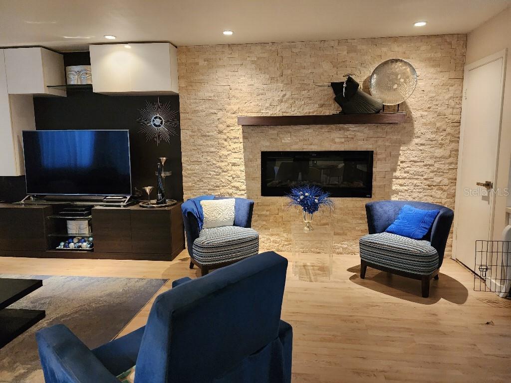 610 Chestnut Oak Circle, Unit 110 Altamonte Springs, FL 32701 - Photo 3 of 15 a living room with furniture and a fireplace