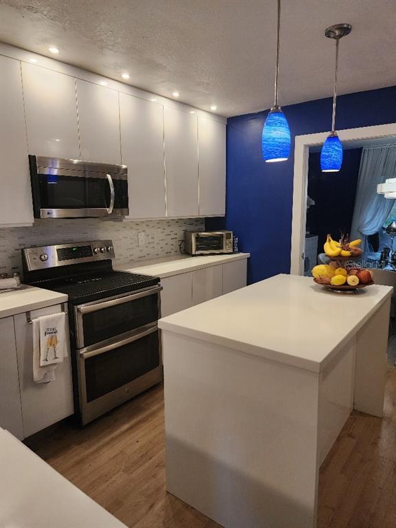 610 Chestnut Oak Circle, Unit 110 Altamonte Springs, FL 32701 - Photo 6 of 15 a kitchen with stainless steel appliances a stove microwave and refrigerator