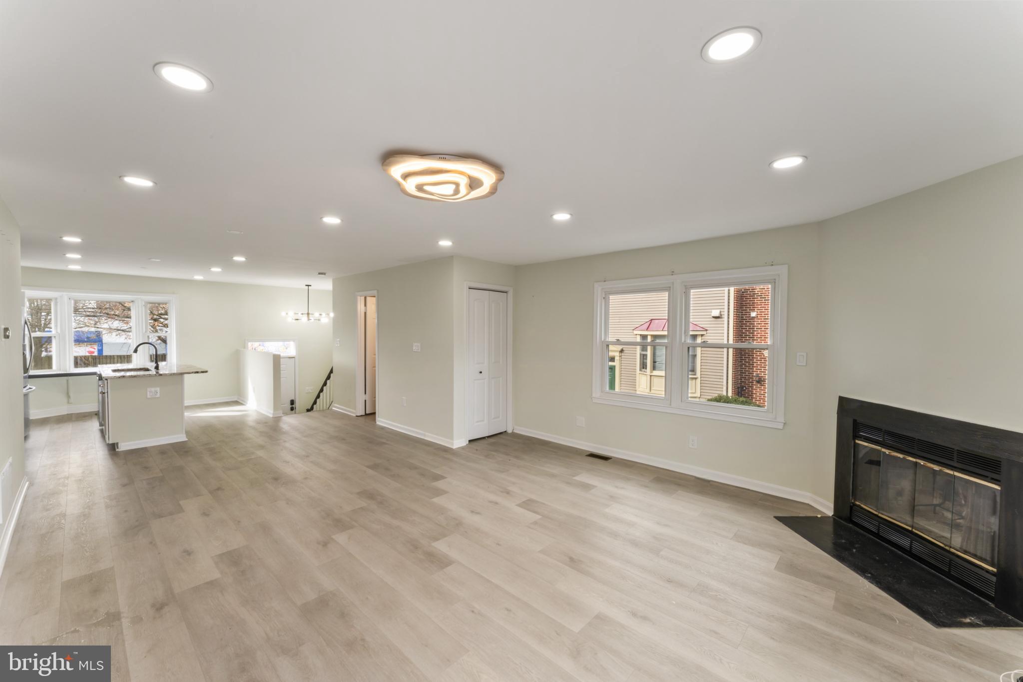 8213 Roxbury Drive Alexandria, VA 22309 - Photo 12 of 32 a view of an empty room with a window and fireplace