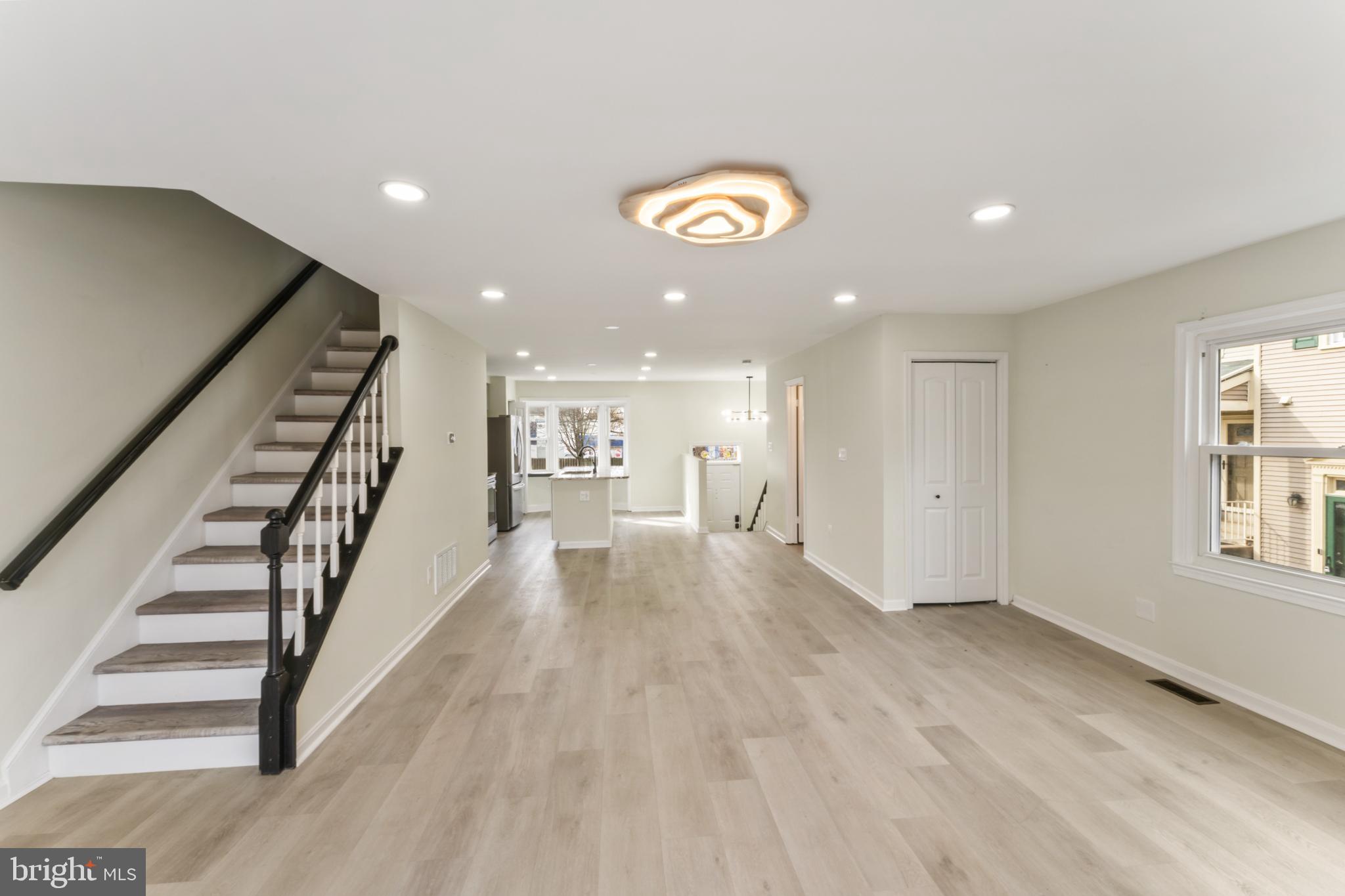 8213 Roxbury Drive Alexandria, VA 22309 - Photo 13 of 32 a view of an empty room with wooden floor and a window