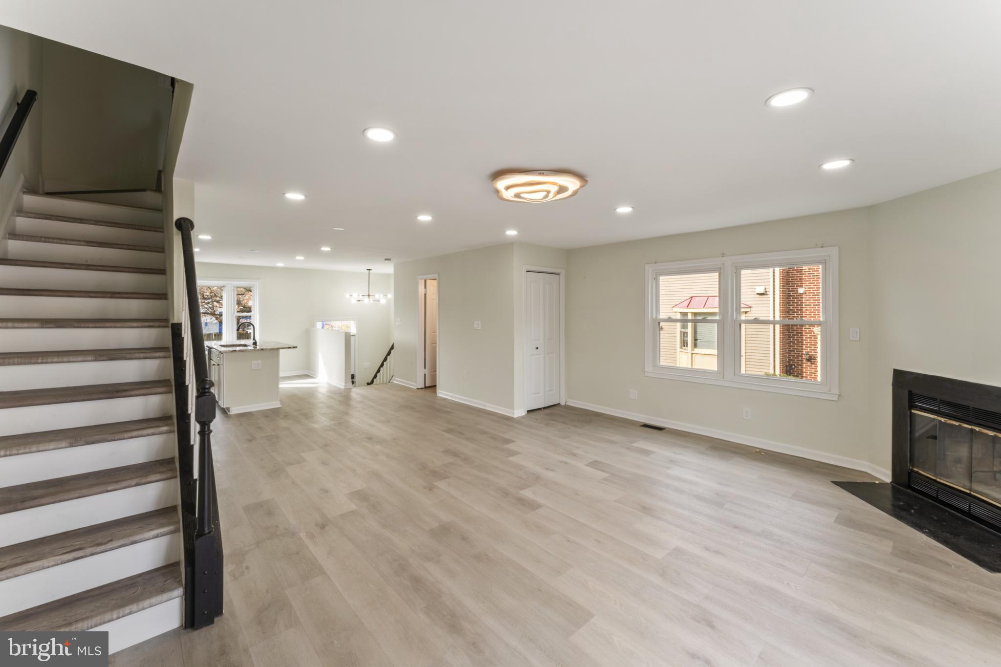 8213 Roxbury Drive Alexandria, VA 22309 - Photo 14 of 32 a view of empty room with wooden floor and fan