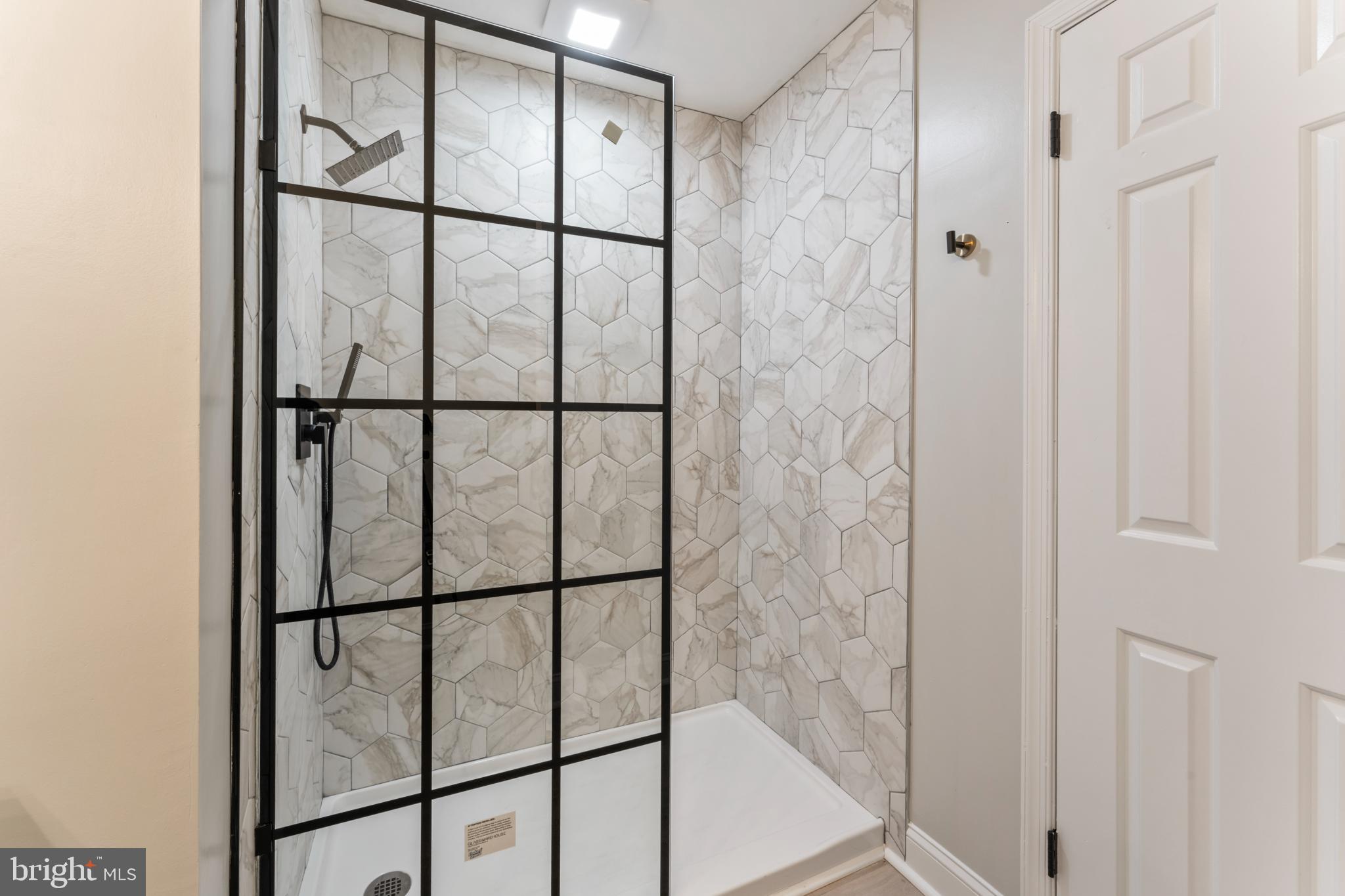8213 Roxbury Drive Alexandria, VA 22309 - Photo 26 of 32 a bathroom with glass shower door