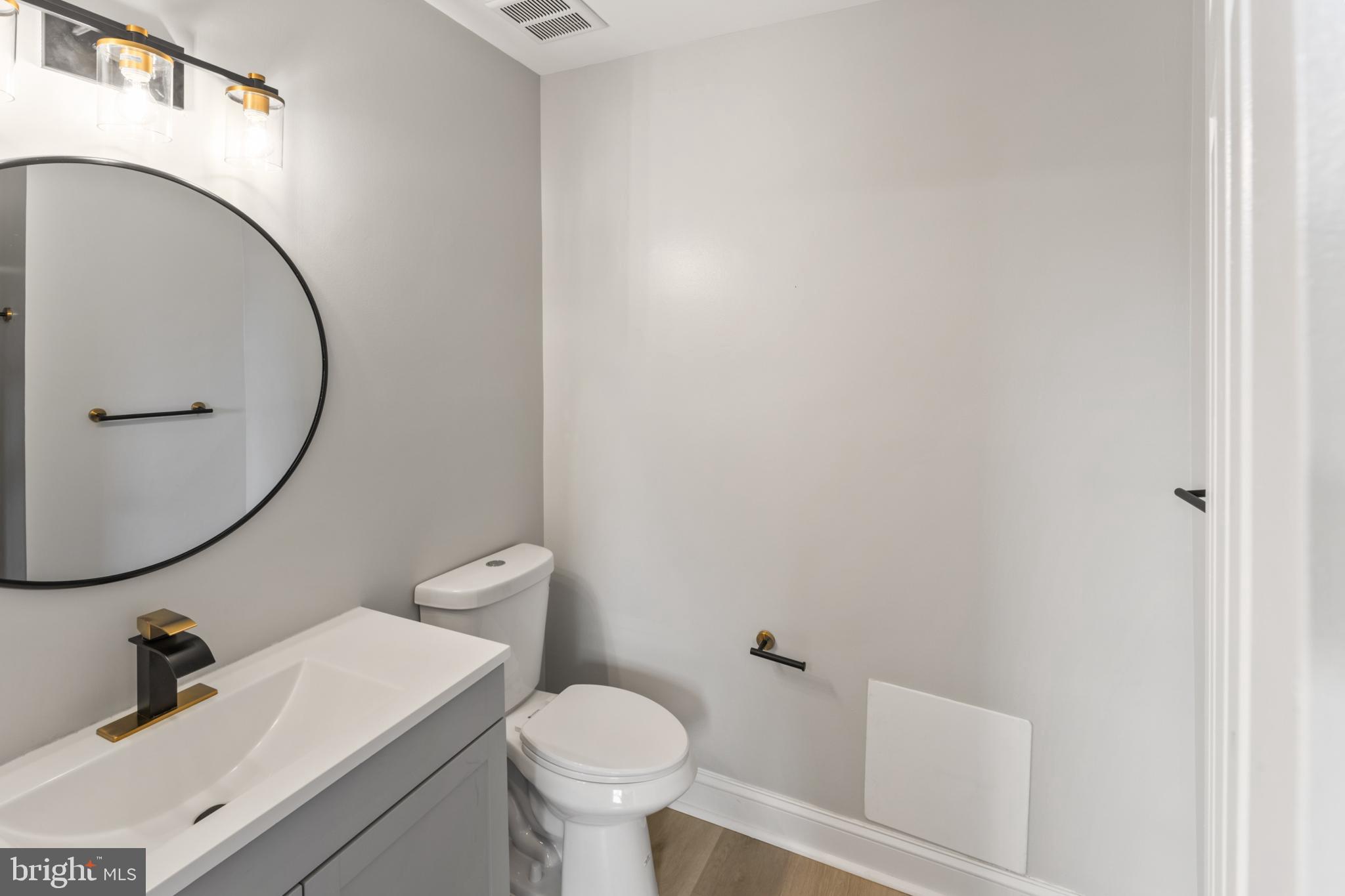 8213 Roxbury Drive Alexandria, VA 22309 - Photo 30 of 32 a bathroom with a sink and a mirror