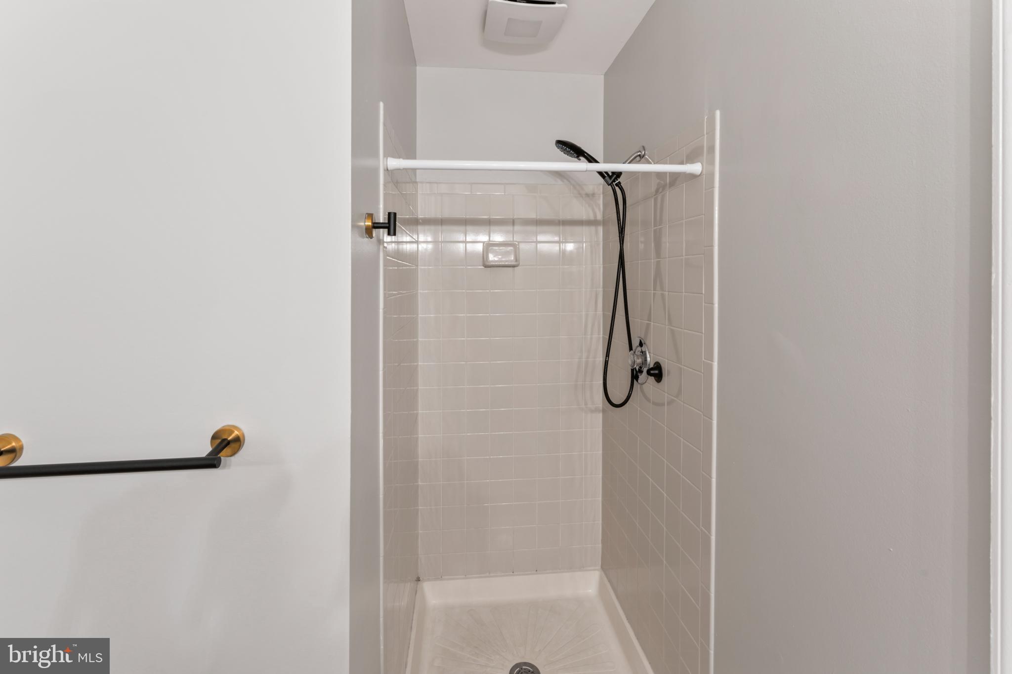 8213 Roxbury Drive Alexandria, VA 22309 - Photo 31 of 32 a bathroom with a shower