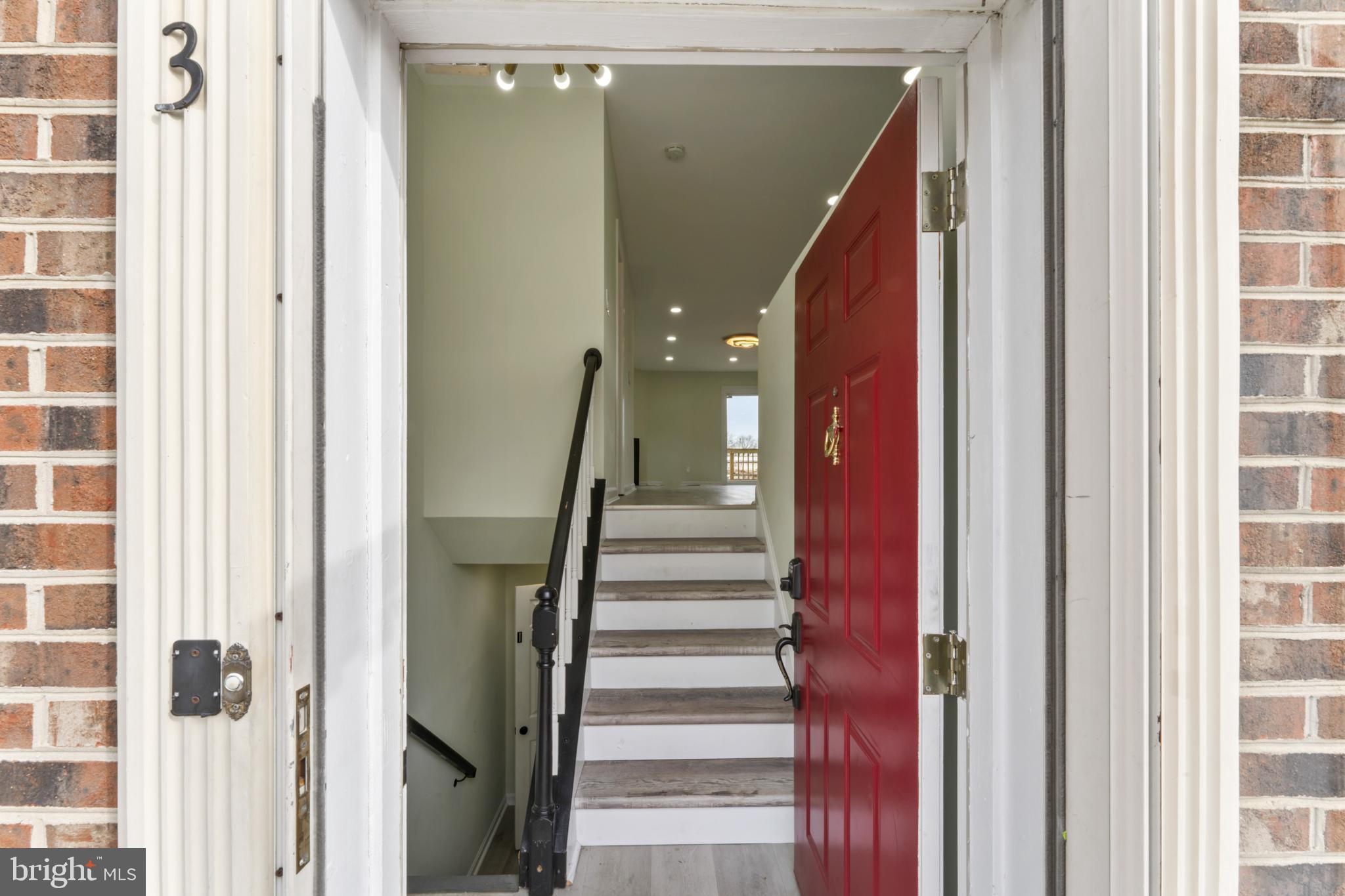 8213 Roxbury Drive Alexandria, VA 22309 - Photo 5 of 32 a view of a hallway with wooden floor and entryway