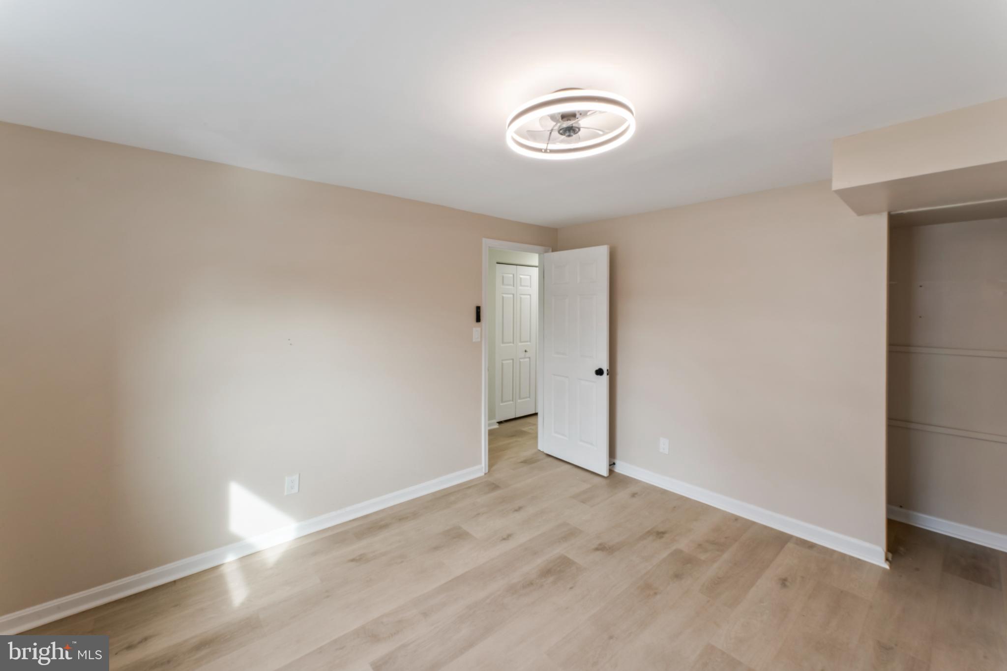 8213 Roxbury Drive Alexandria, VA 22309 - Photo 7 of 32 a view of an empty room and wooden floor