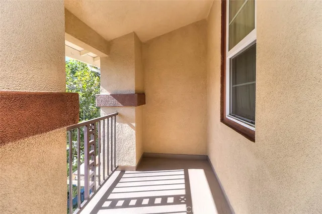 a bathroom with a vase of flowers