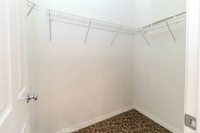 an empty room with wooden floor