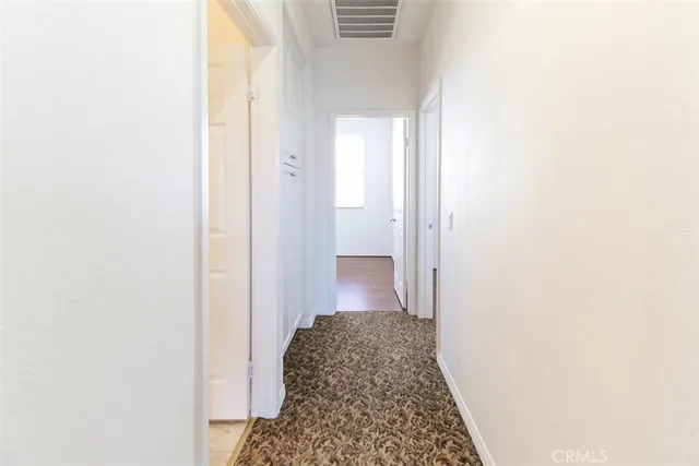 a bathroom with a sink a toilet a mirror and shower