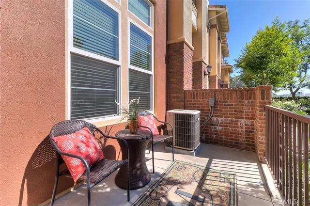 a view of a patio with couple of chairs