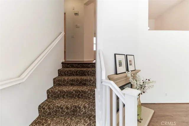 a kitchen with kitchen island white cabinets appliances and a sink