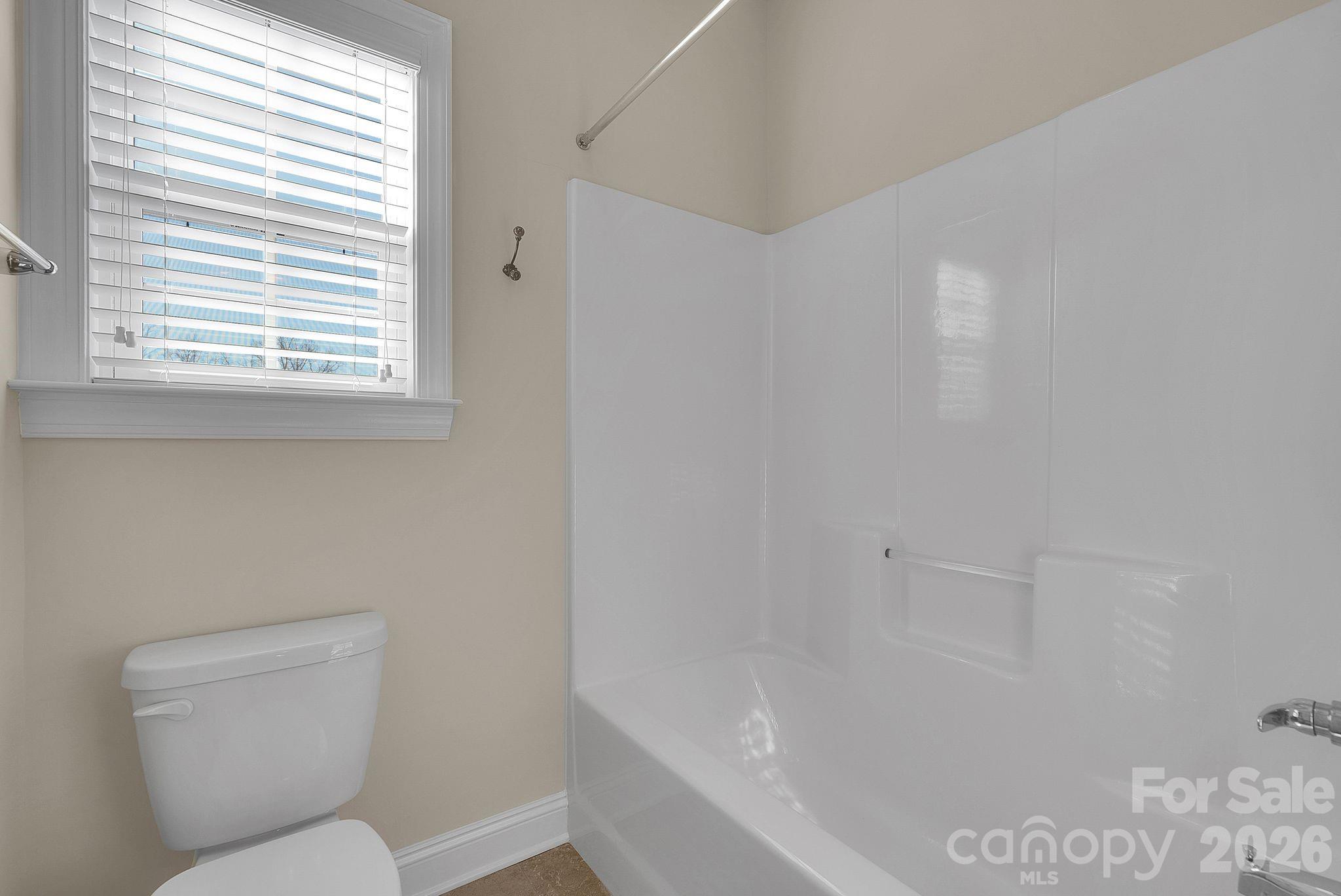 535 Brightleaf Place Northwest Concord, NC 28027 - Photo 28 of 48 a bathroom with a toilet sink and bathtub
