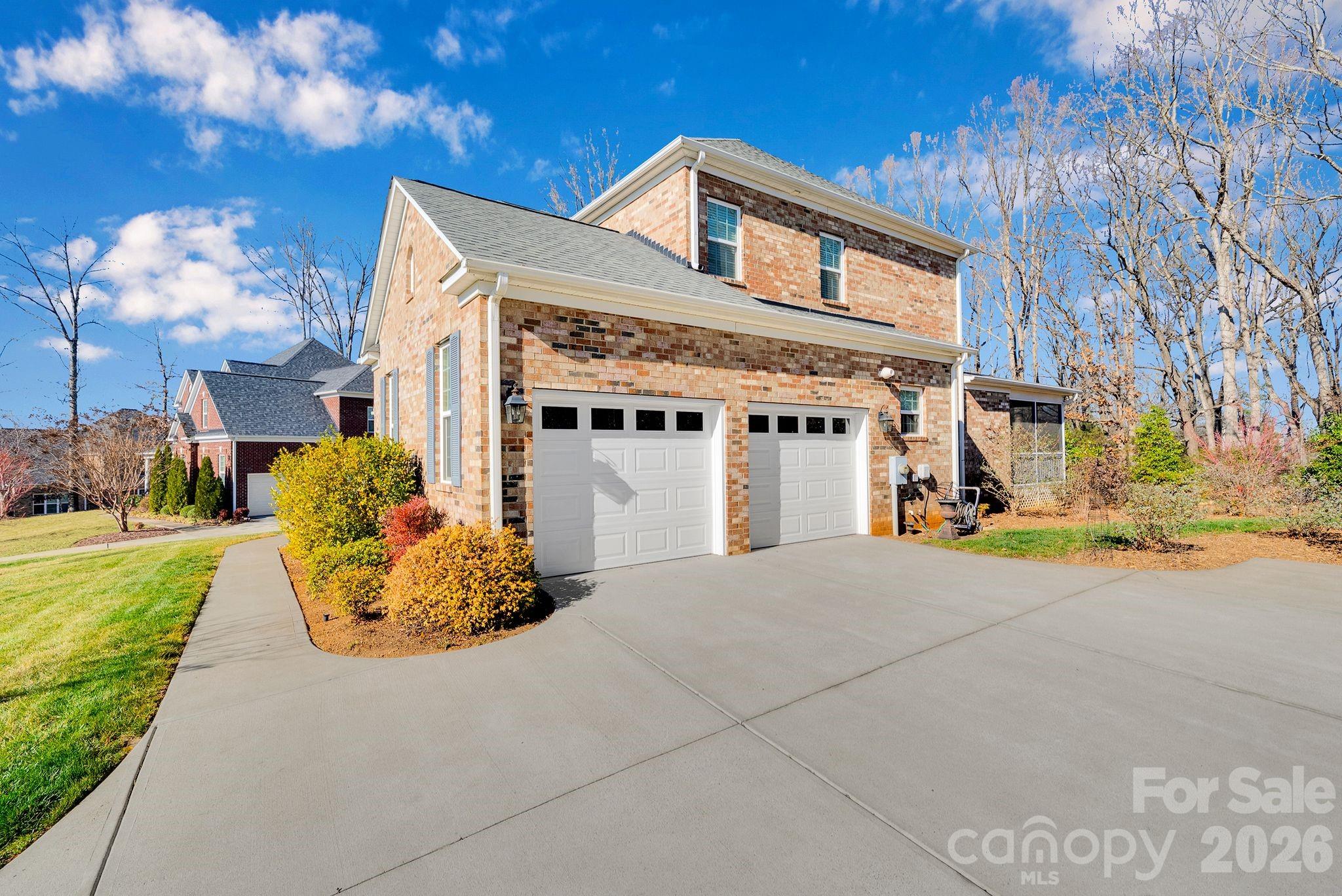 535 Brightleaf Place Northwest Concord, NC 28027 - Photo 37 of 48 a front view of a house with a yard
