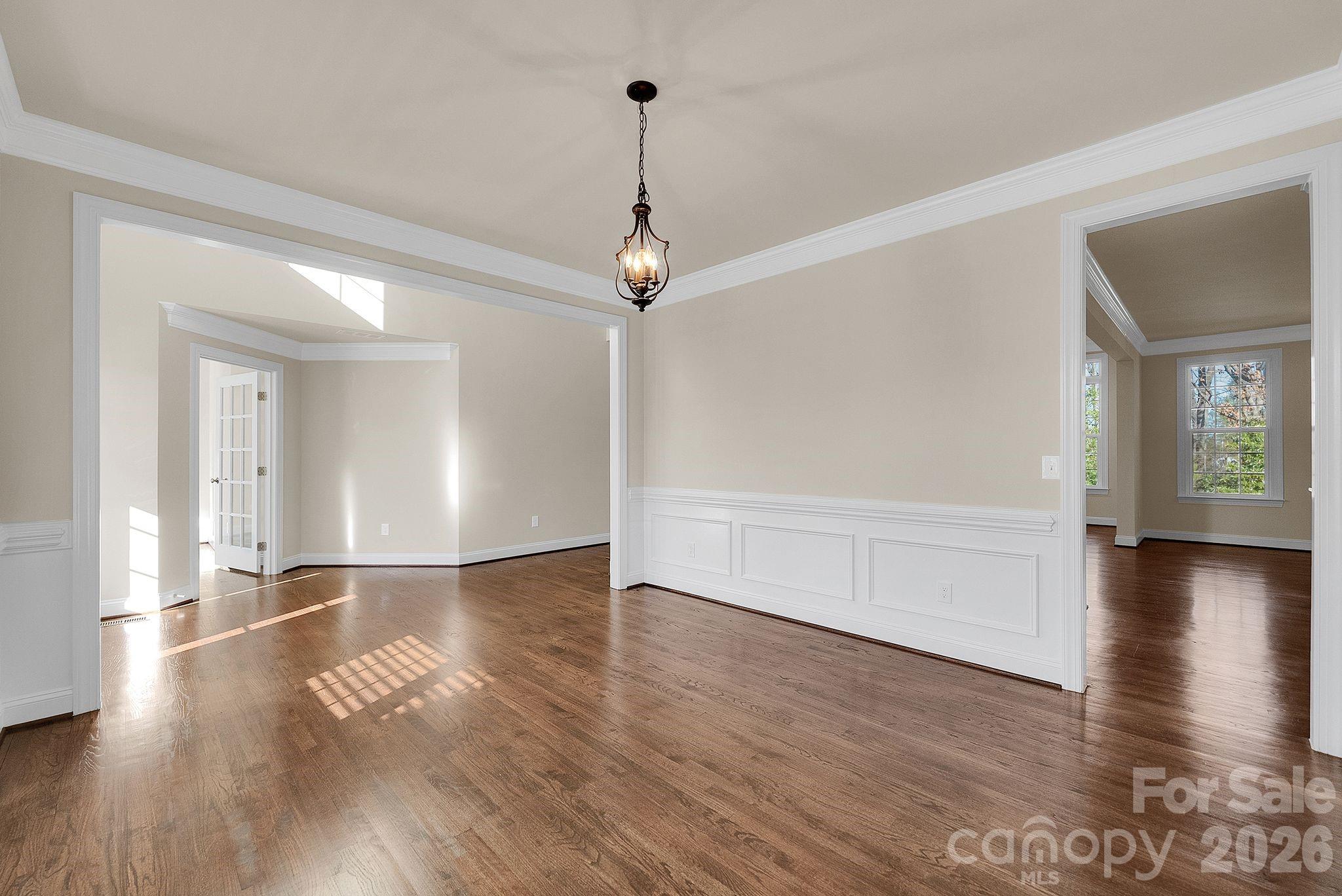 535 Brightleaf Place Northwest Concord, NC 28027 - Photo 4 of 48 a view of a livingroom with wooden floor