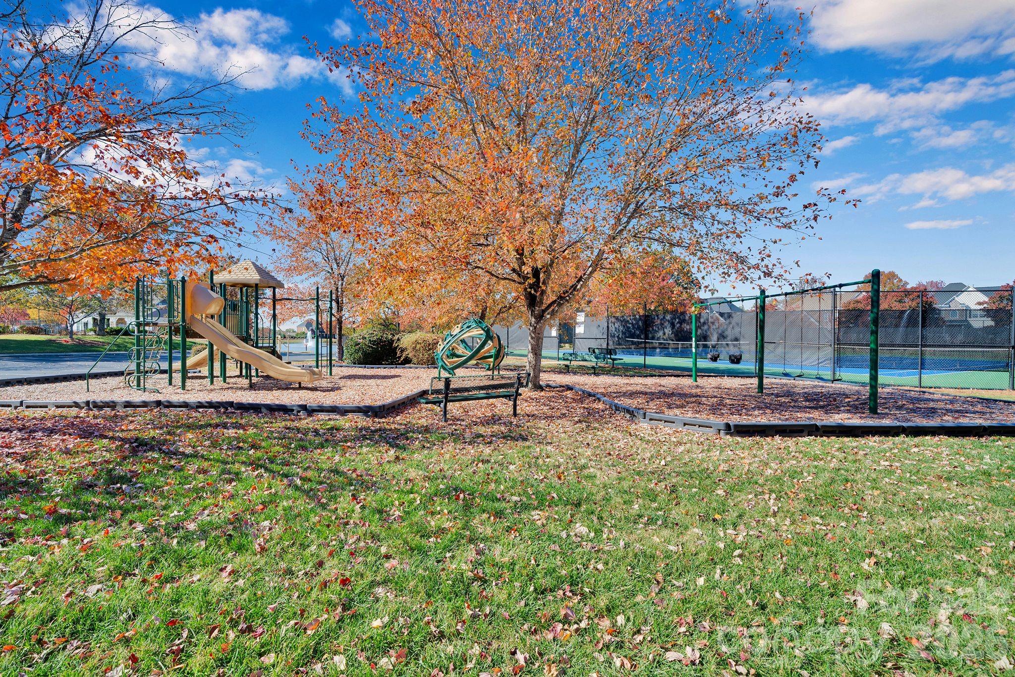 535 Brightleaf Place Northwest Concord, NC 28027 - Photo 45 of 48 a view of a garden with a slide