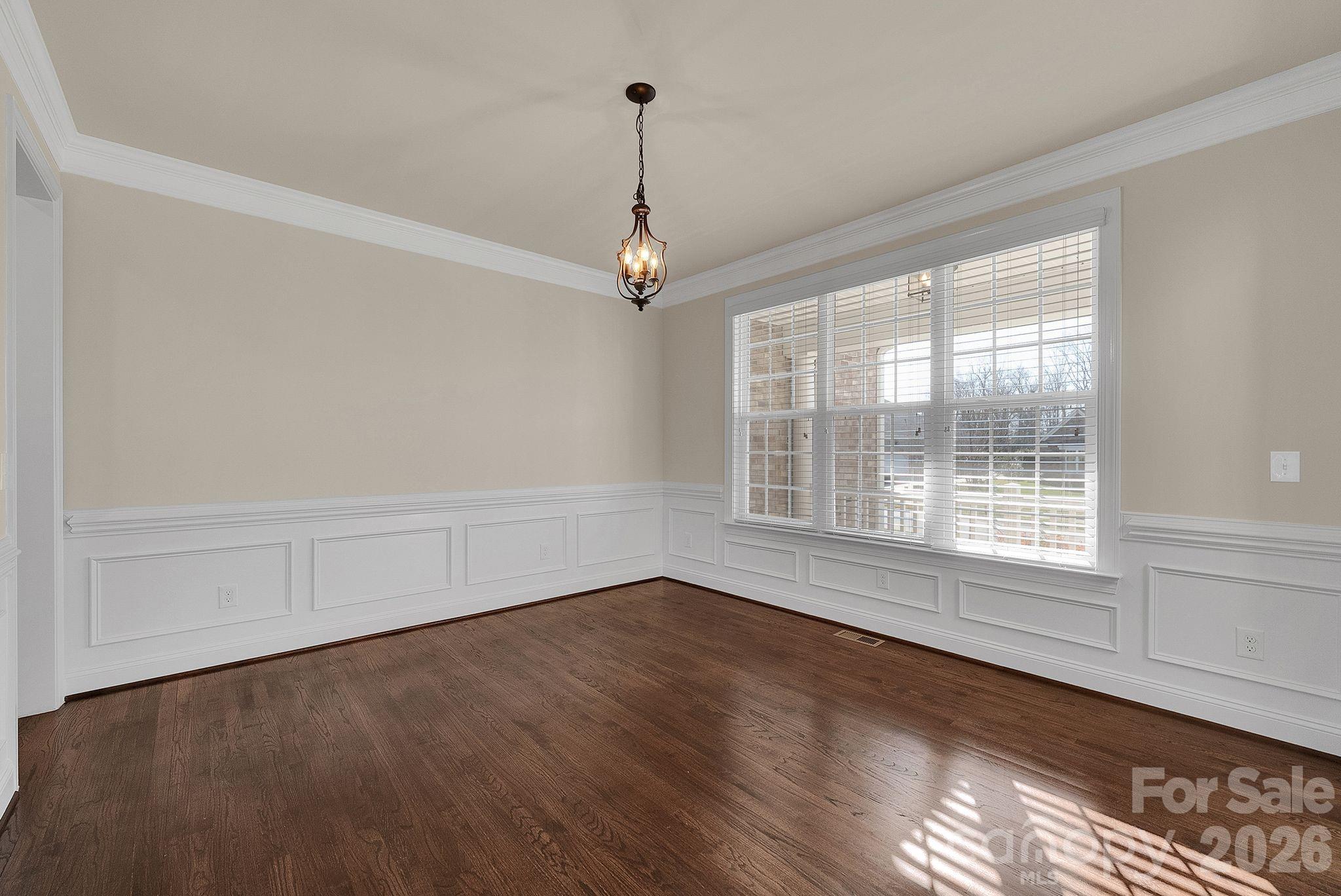 535 Brightleaf Place Northwest Concord, NC 28027 - Photo 5 of 48 a view of a livingroom with wooden floor and a window