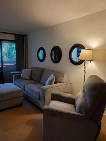 a living room with furniture and a window