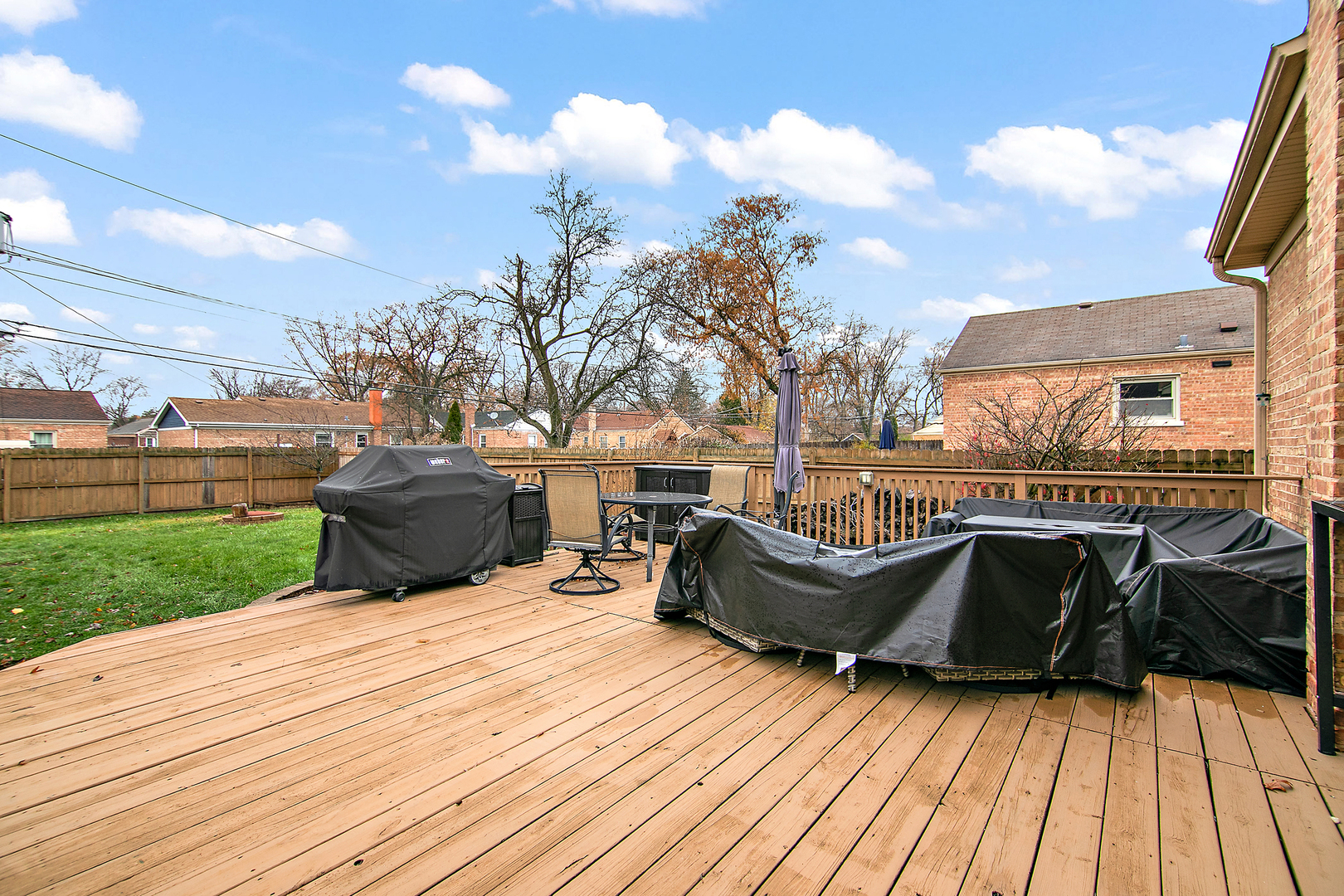 18524 Gottschalk Avenue Homewood, IL 60430 - Photo 26 of 28 a view of a roof deck with table and chairs a couches and potted plants