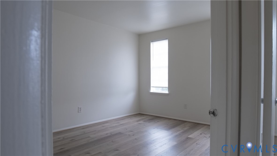 419 Roxana Road Henrico, VA 23075 - Photo 27 of 56 a view of an empty room with wooden floor and a window