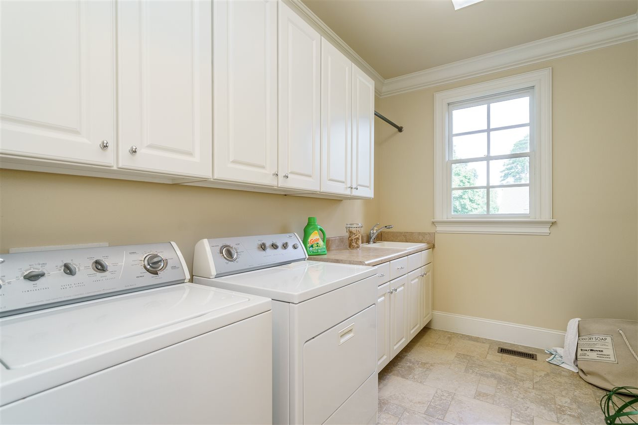 1315 Mayfair Road Raleigh, NC 27608 - Photo 23 of 25 ...has a deep sink and additional cabinets for storage Laundry Room