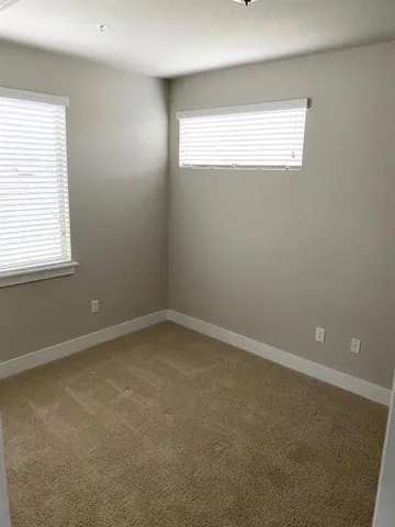 a bathroom with a shower and a toilet