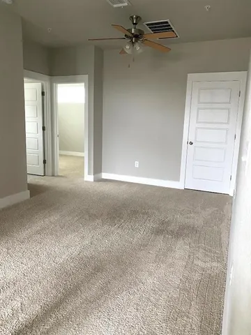 a kitchen with granite countertop a stove a sink and a refrigerator