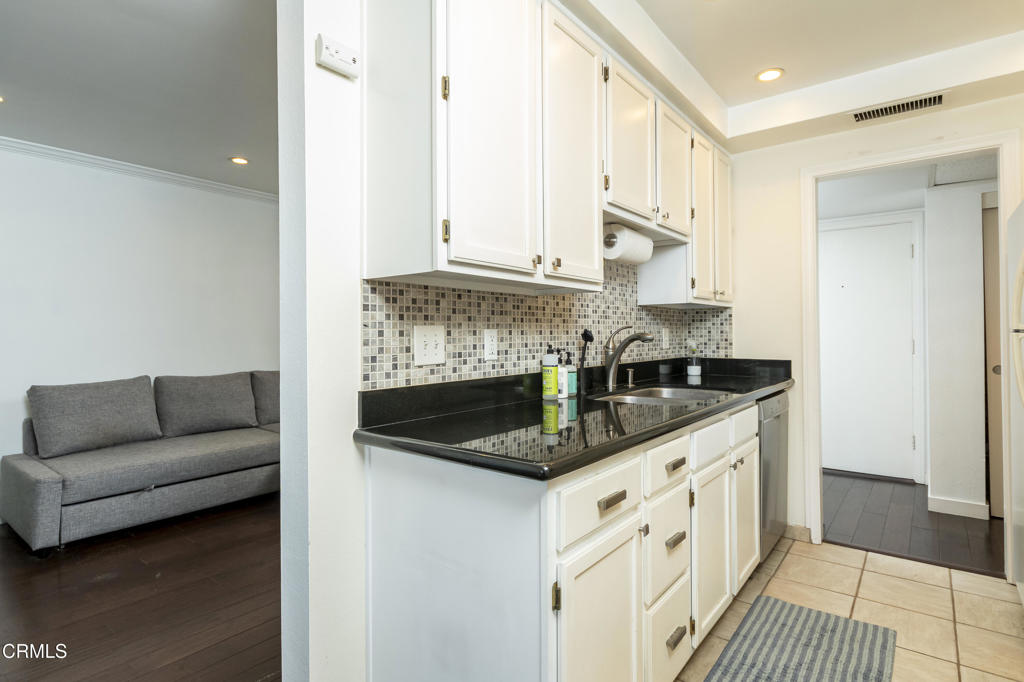 355 South Madison Avenue, Unit 212 Pasadena, CA 91101 - Photo 12 of 27 a kitchen with stainless steel appliances granite countertop a sink and a stove