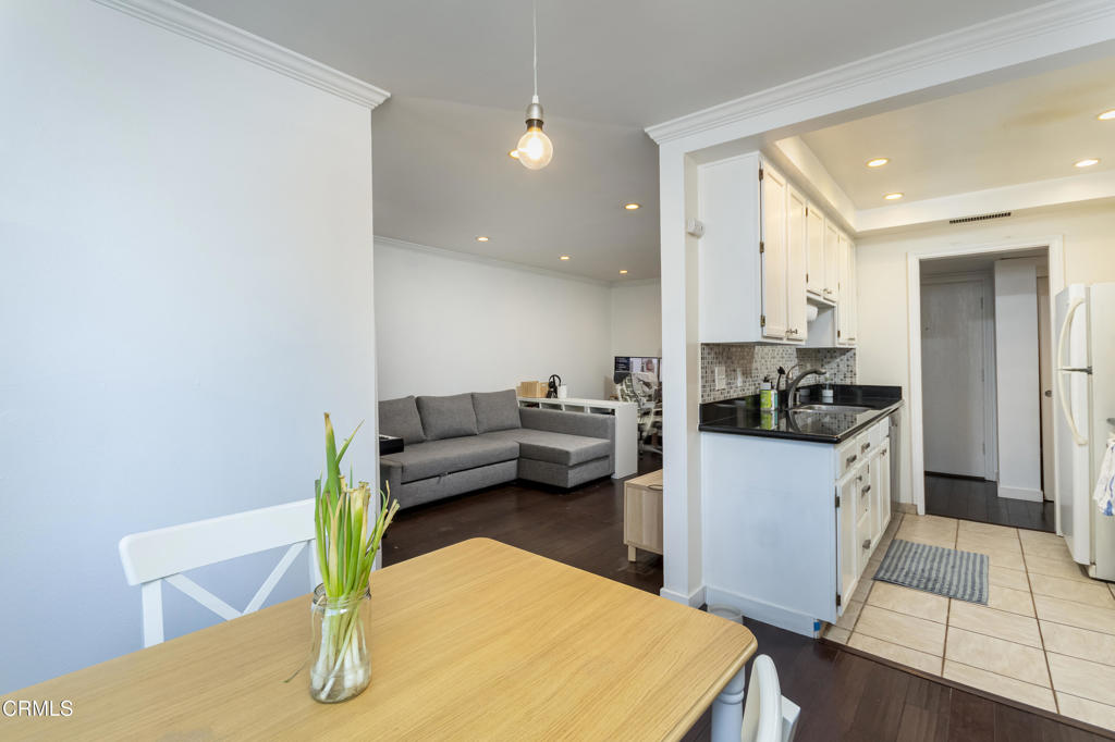 355 South Madison Avenue, Unit 212 Pasadena, CA 91101 - Photo 16 of 27 a living room with furniture and a wooden floor