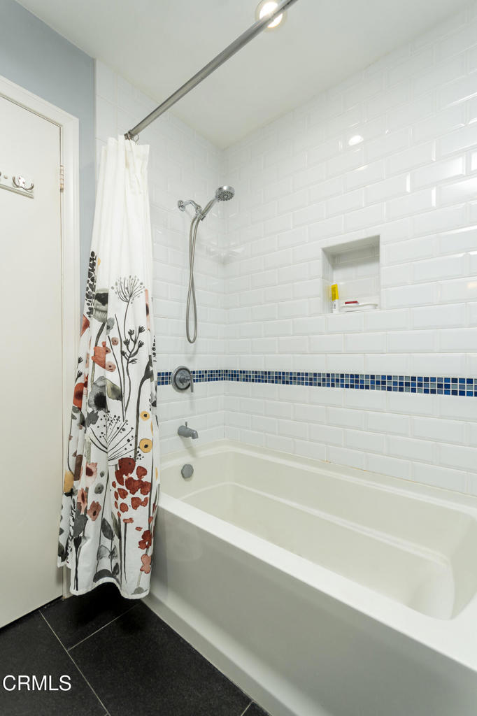 355 South Madison Avenue, Unit 212 Pasadena, CA 91101 - Photo 19 of 27 a bathroom with a bathtub and a shower
