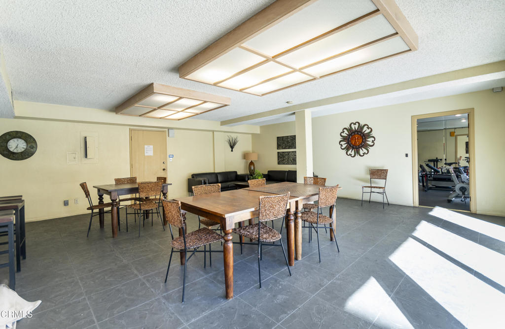 355 South Madison Avenue, Unit 212 Pasadena, CA 91101 - Photo 25 of 27 a view of a dining room with furniture and a potted plant