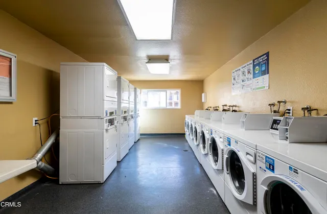 a kitchen with refrigerator and cabinets