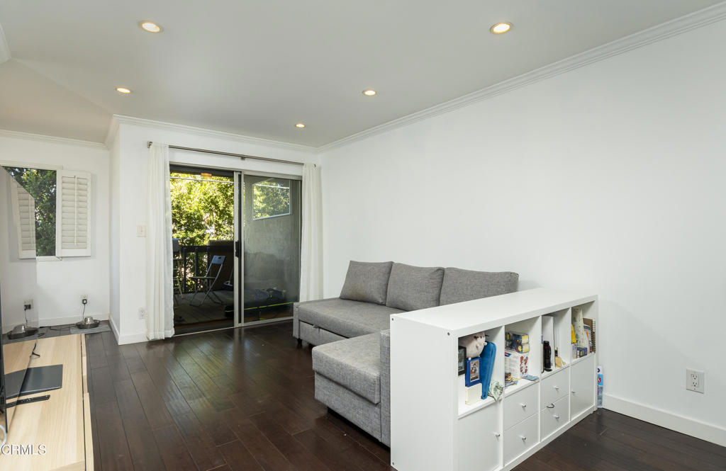 355 South Madison Avenue, Unit 212 Pasadena, CA 91101 - Photo 6 of 27 a living room with furniture and a large window