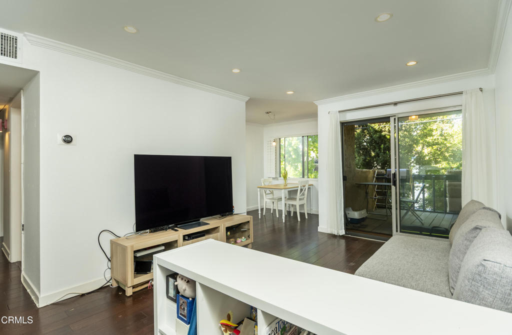 355 South Madison Avenue, Unit 212 Pasadena, CA 91101 - Photo 7 of 27 a living room with furniture and a flat screen tv