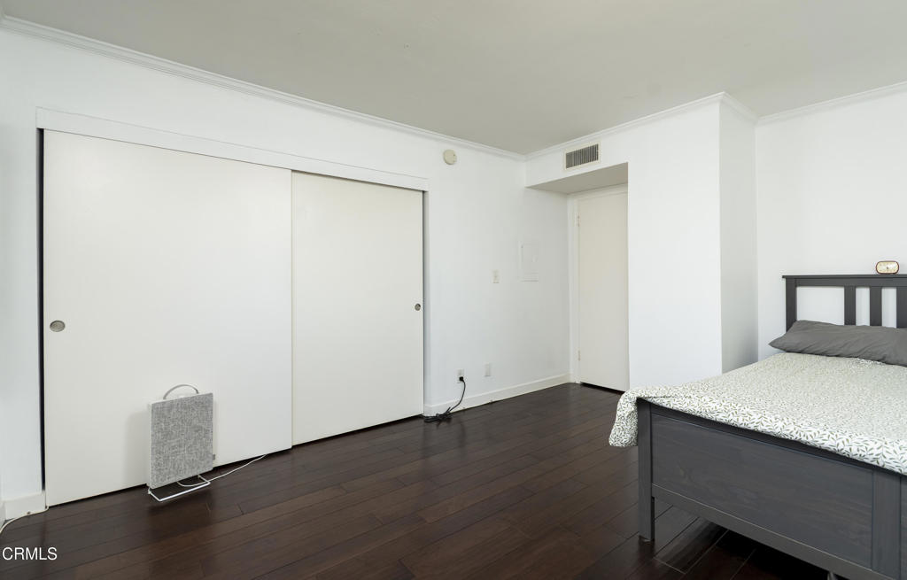 355 South Madison Avenue, Unit 212 Pasadena, CA 91101 - Photo 10 of 27 an empty room with wooden floor