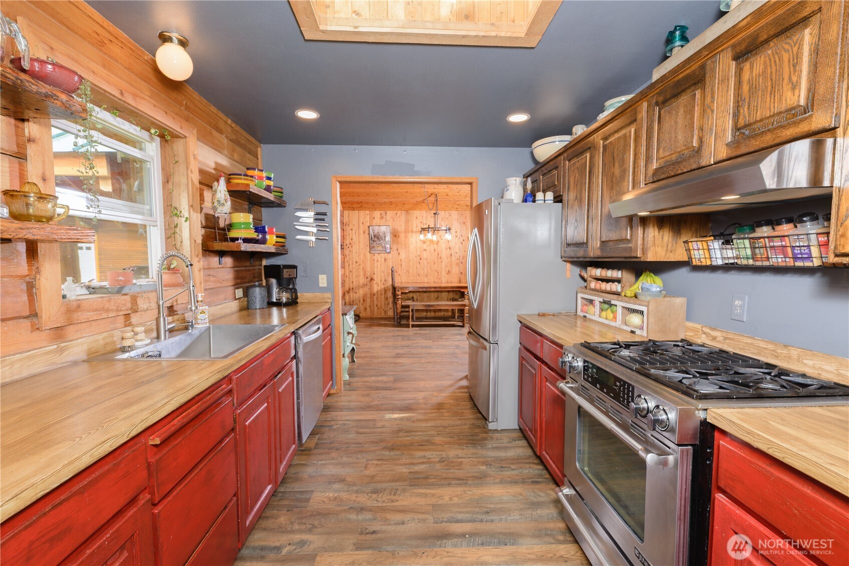 134 Bishop Road Port Angeles, WA 98363 - Photo 15 of 38 a kitchen with stainless steel appliances granite countertop a stove a sink dishwasher and a refrigerator