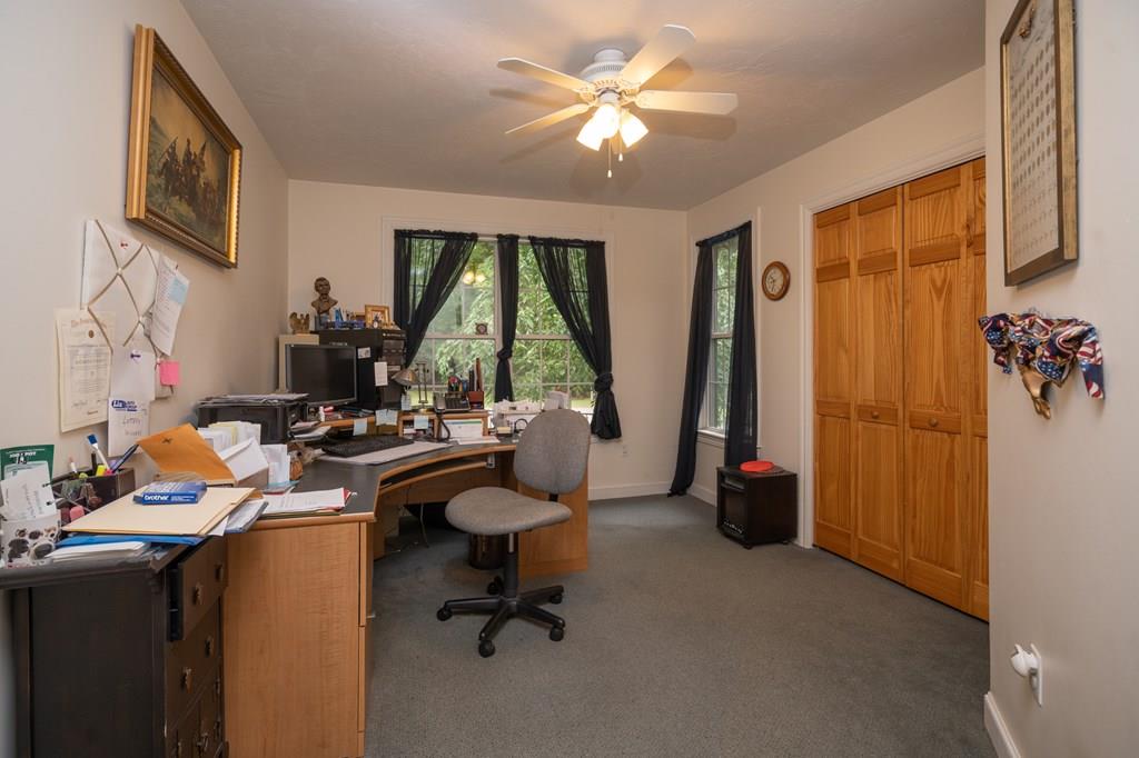 70 Allen Hill Road Holland, MA 01521 - Photo 36 of 36 a view of a workspace with furniture and a window