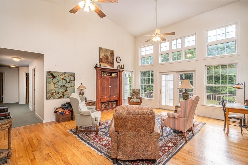 70 Allen Hill Road Holland, MA 01521 - Photo 6 of 36 a living room with furniture large window and wooden floor