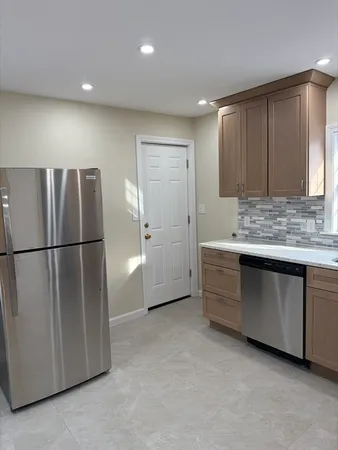 a view of kitchen with a refrigerator a sink and dishwasher