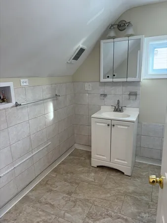 a bathroom with a sink a toilet and vanity