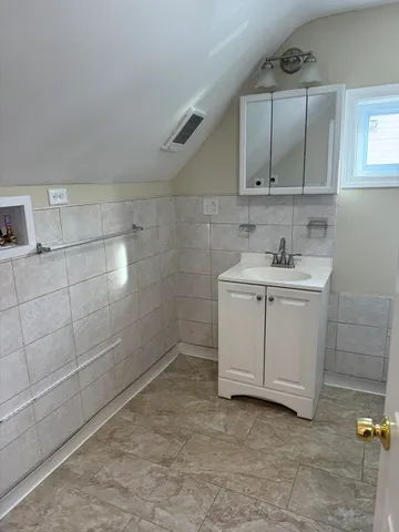 a bathroom with a sink a toilet and vanity